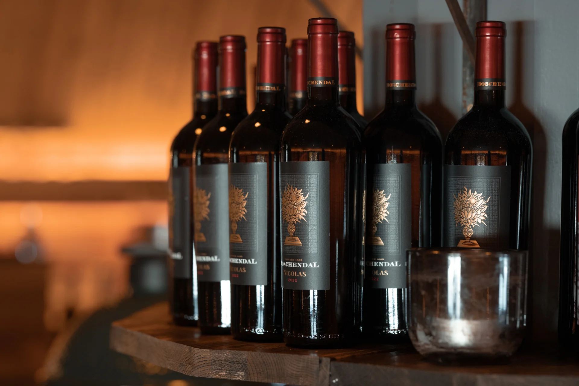 Row of Boschendal Nicolas red wine bottles on the shelf